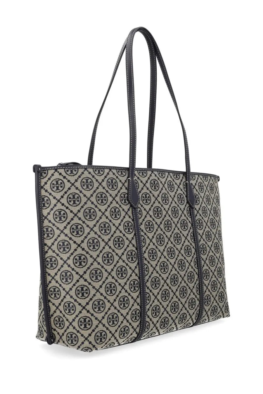 Beige and black tory burch women’s monogram tote bag with repeating logo pattern and leather accents