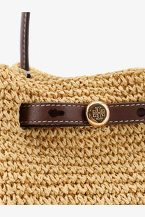 Beige woven straw tote bag with brown leather strap and gold-tone tory burch logo clasp in white romy raffia bucket bag
