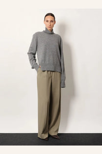 Toteme women’s cashmere turtleneck sweater in soft heather gray with relaxed fit and subtle texture