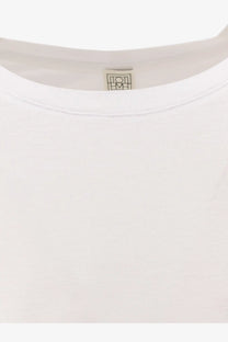 White cotton and lyocell long sleeve t-shirt by Toteme with minimalist logo tag at the neckline
