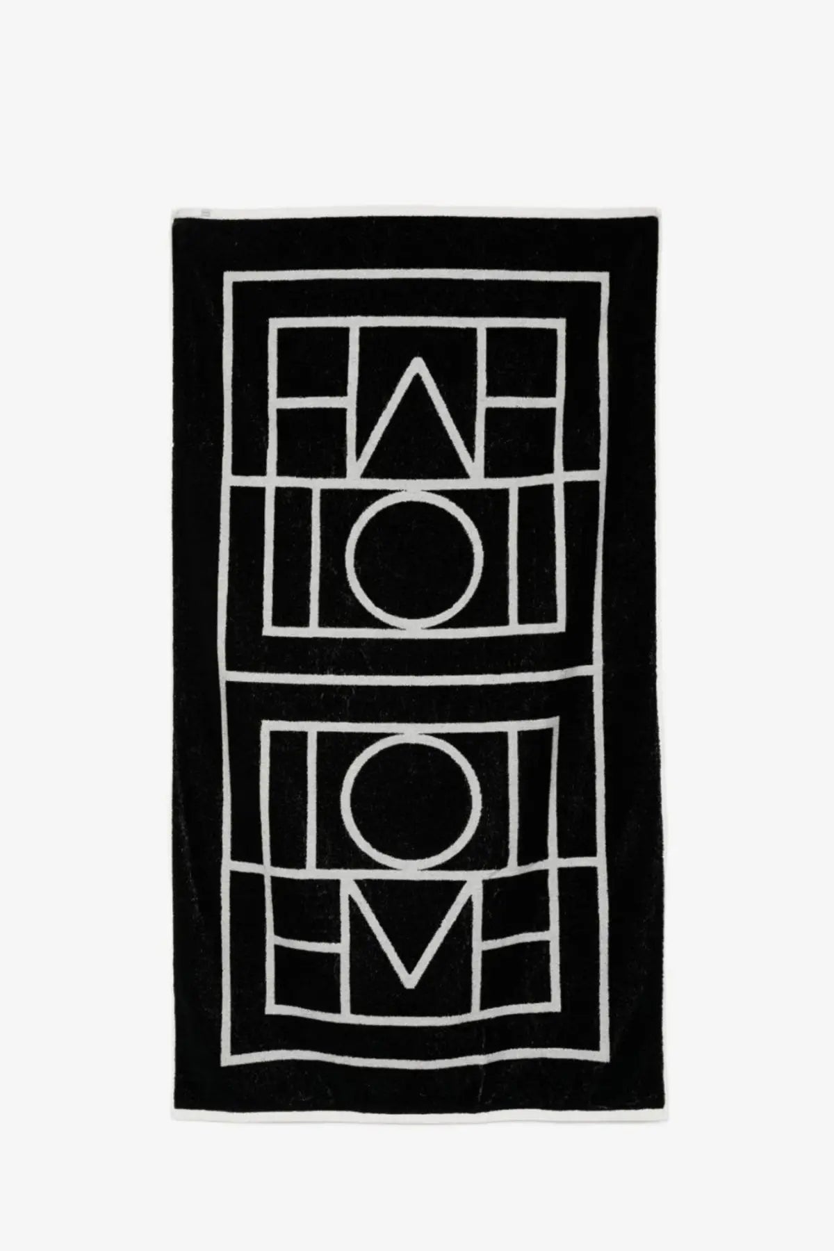 Toteme women’s black cotton beach towel with bold white geometric love design for stylish beach use