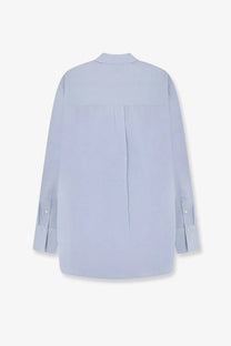 Toteme women’s cotton and linen oversized summer shirt blue soft light blue long-sleeved button-up back view with pleats