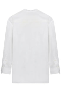 Toteme women’s white cotton long-sleeved shirt with classic collar and subtle back pleats shown from the back side