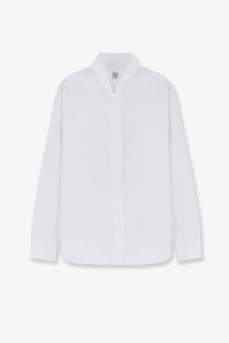 Toteme women’s white cotton shirt with minimalist button-up design and subtle texture for modern style