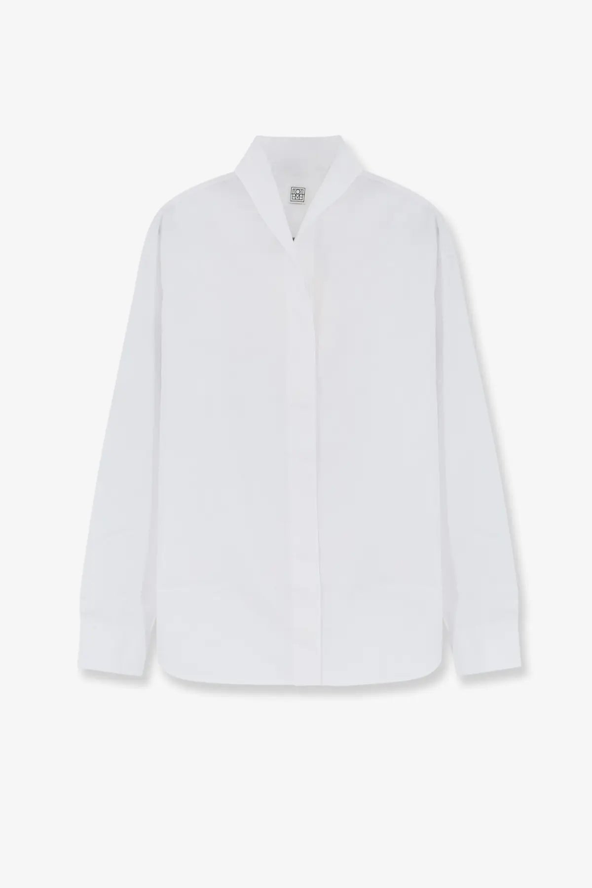 Toteme women’s white cotton button up shirt with minimalist design and subtle texture