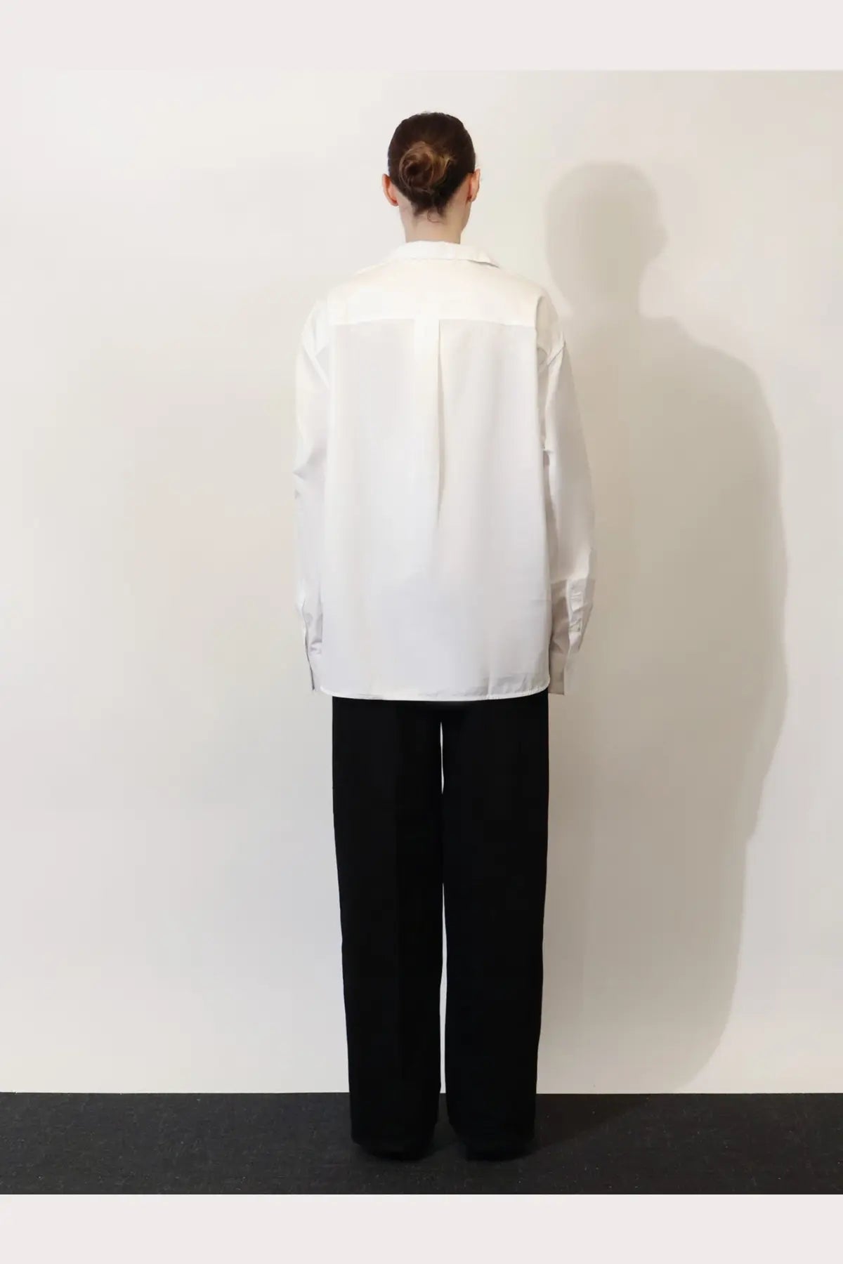 Toteme women’s white cotton shirt with a minimalist relaxed fit and subtle front panel detailing
