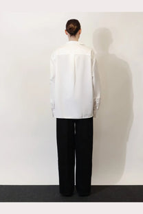 Toteme women’s white cotton shirt with a minimalist relaxed fit and subtle front panel detailing