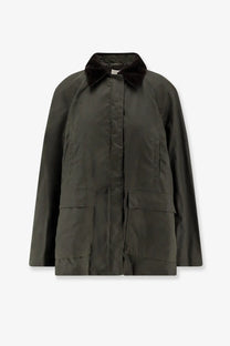 Dark olive green waxed cotton field jacket with plush black velvet collar by Toteme for women organic cotton wear