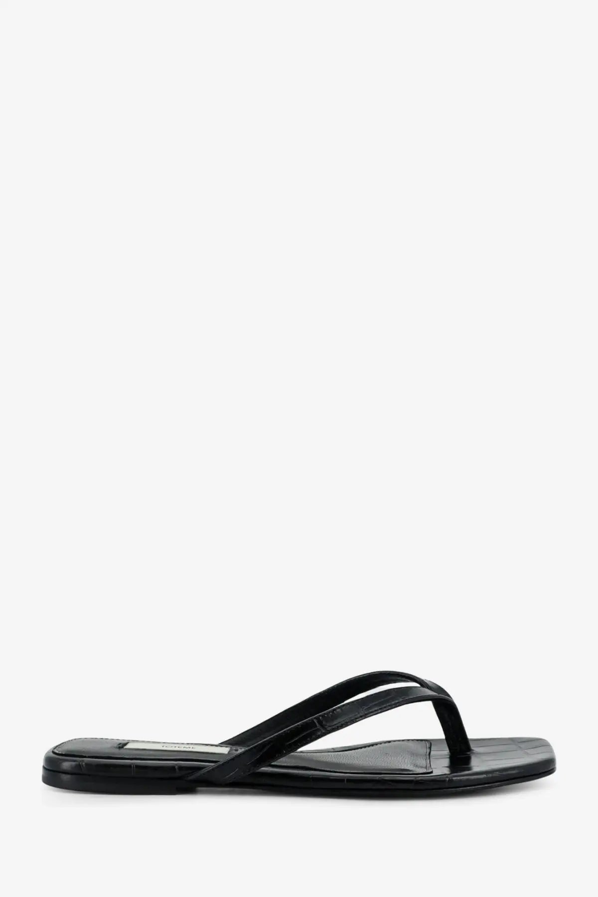 Toteme women’s croco embossed leather sandals in black patent leather with sleek minimalist design and subtle crocodile texture