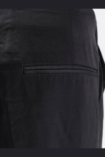 Black satin-trimmed pocket detail on toteme women’s easy raw edge viscose and linen black trousers front side