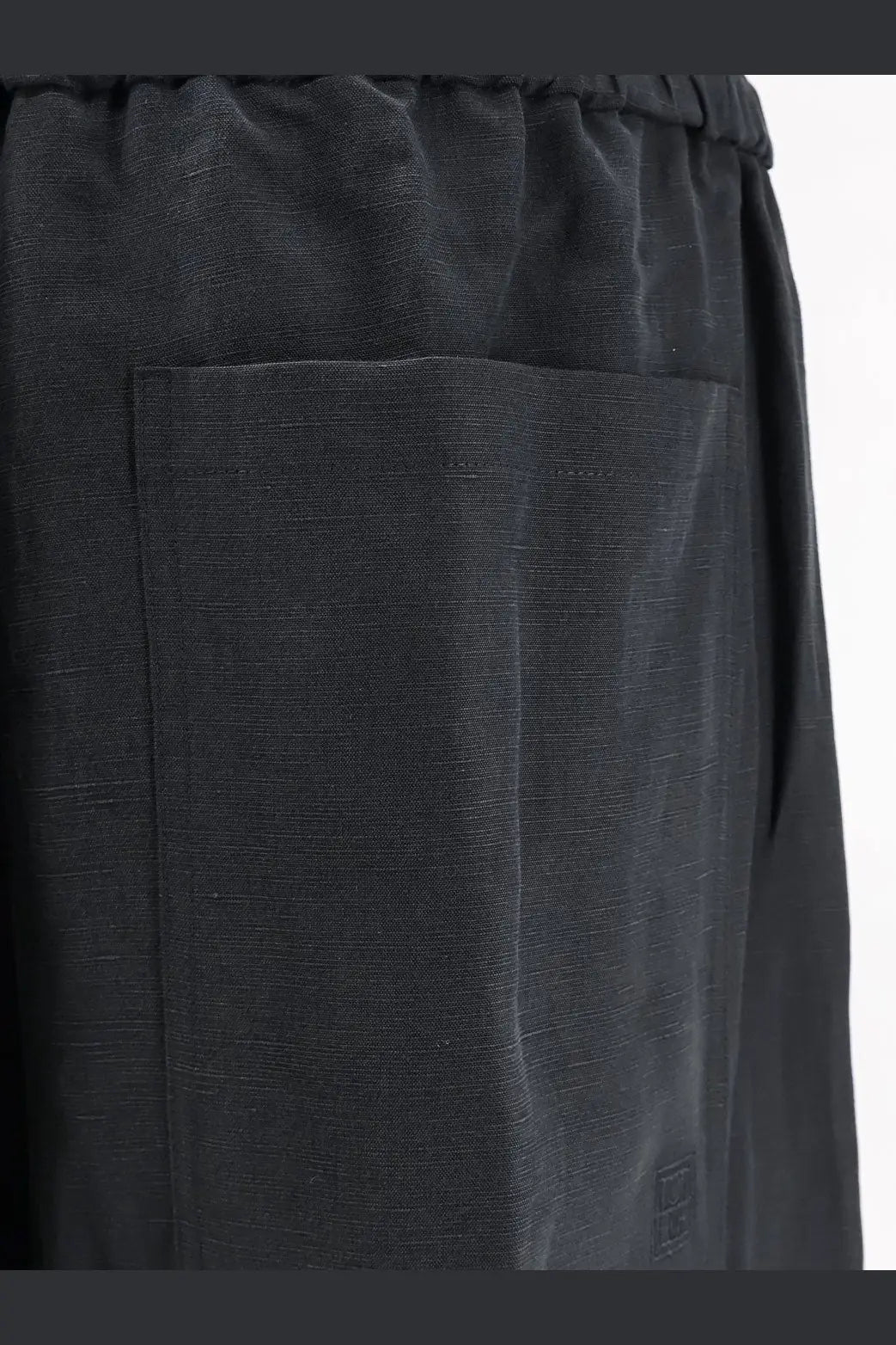 Toteme women’s black linen and lyocell blend trousers with a subtle textured weave and elastic waistband