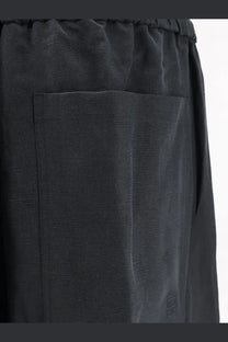 Toteme women’s black linen and lyocell blend trousers with a subtle textured weave and elastic waistband