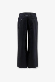 Toteme women’s black relaxed cotton trousers with a tailored fit and subtle front pockets with metallic buttons