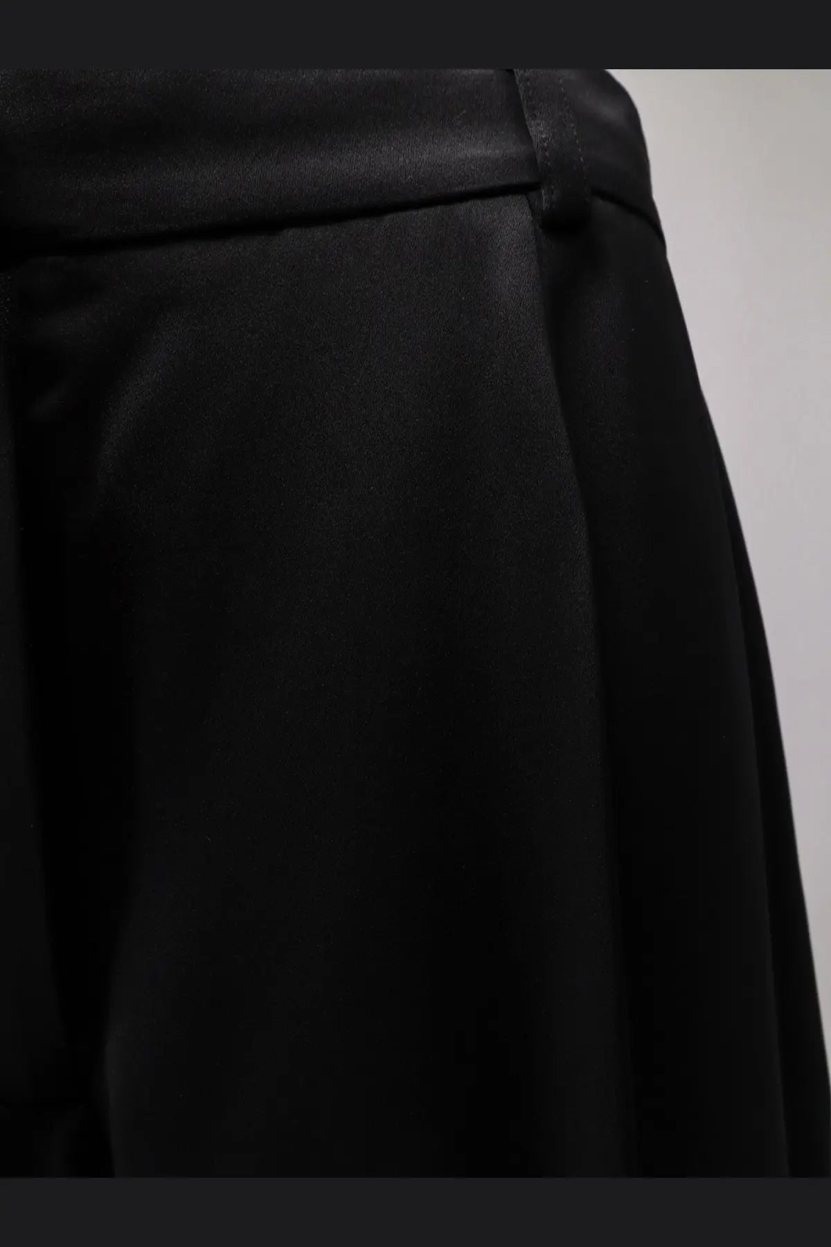 Toteme women’s black satin trousers with a smooth glossy finish and structured waistband in satin material