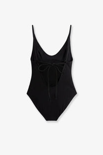 Toteme women’s black nylon one piece swimsuit with thin straps and a tied bow at the back shown from the back side