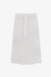 White linen apron with tied waistband and two front pockets complementing toteme women’s tie waist cotton and linen skirt white