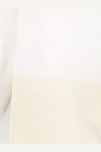 Toteme women’s tuxedo satin viscose shirt white featuring soft cream fabric with smooth texture and subtle hem stitching