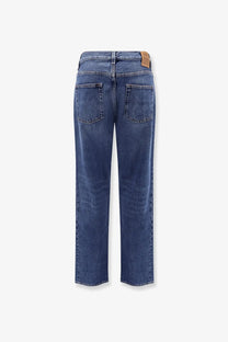 Blue denim jeans with a straight-leg cut and brown leather brand patch at waistband by Toteme women