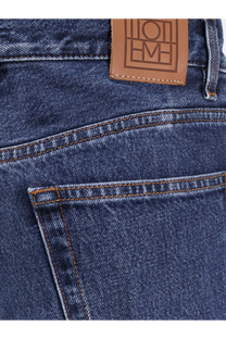Dark blue toteme women’s wide leg organic cotton jeans showing back with brown leather embossed brand patch