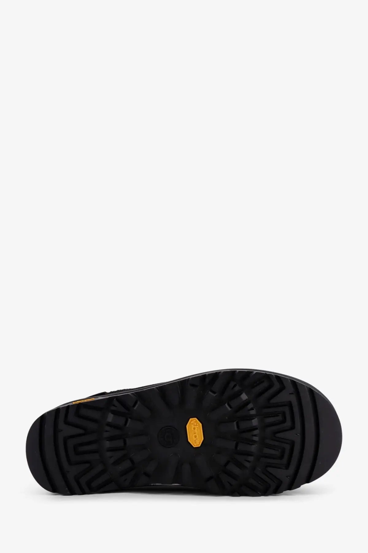 Black rubber sole with distinctive tread and orange hexagonal logo on ugg men’s tasman gtx suede slip black back side