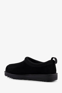 Ugg men’s tasman gtx black suede slip-on shoe with chunky rubber sole and heel pull tab shown from the back