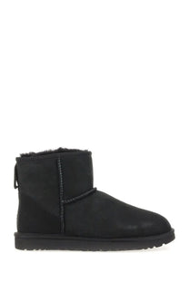Ugg women’s classic mini black boot with suede upper and plush shearling lining for warmth and comfort