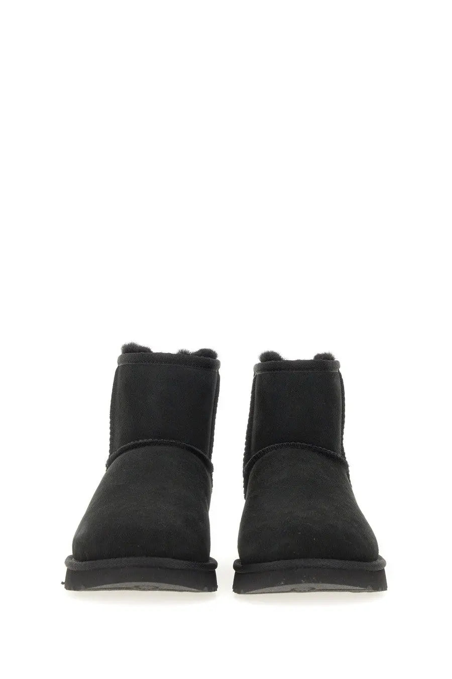UGG women’s classic mini boot in black suede with plush shearling lining for warmth and comfort