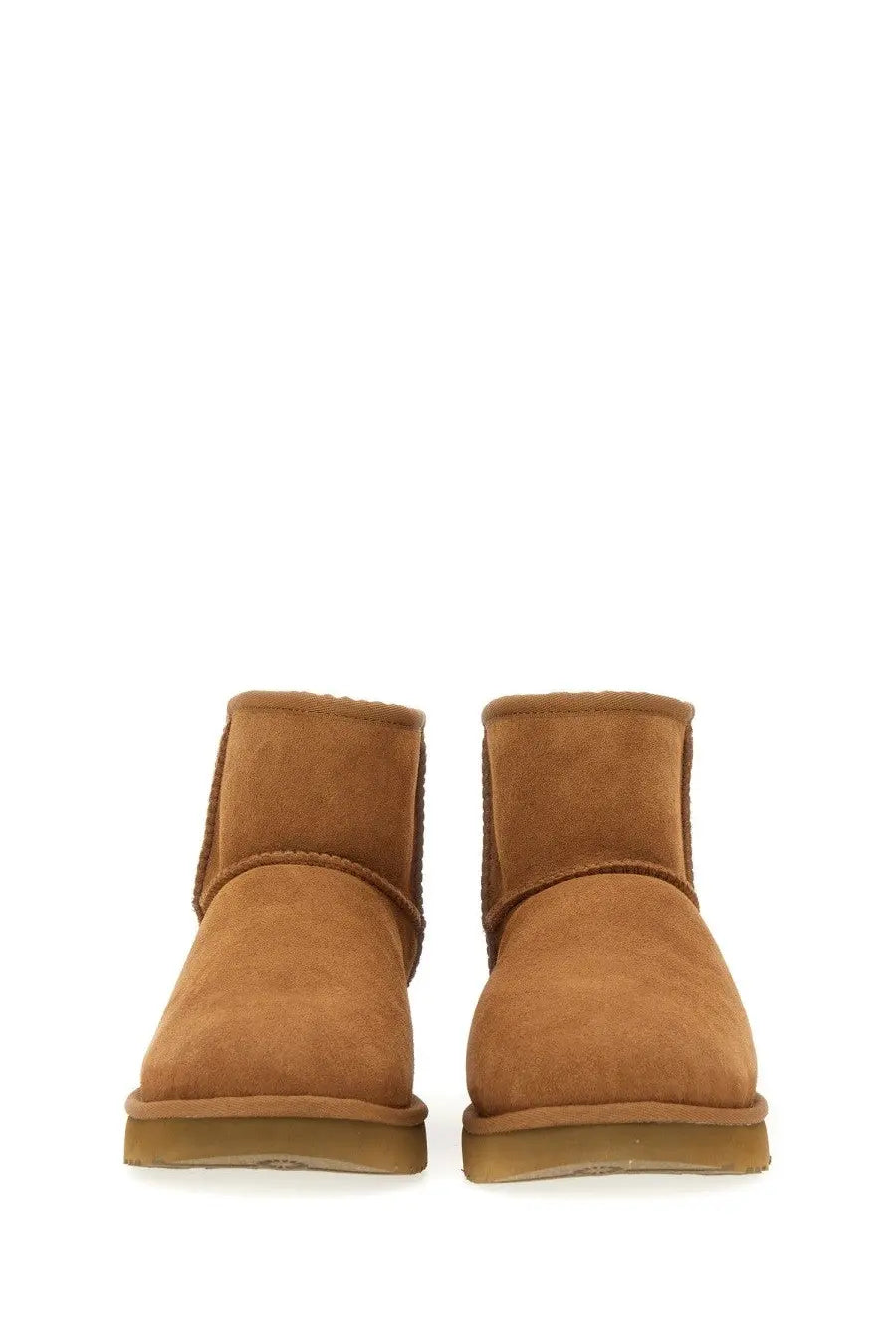 Ugg women’s boot classic mini brown tan suede booties with soft plush interior and classic ankle-high design