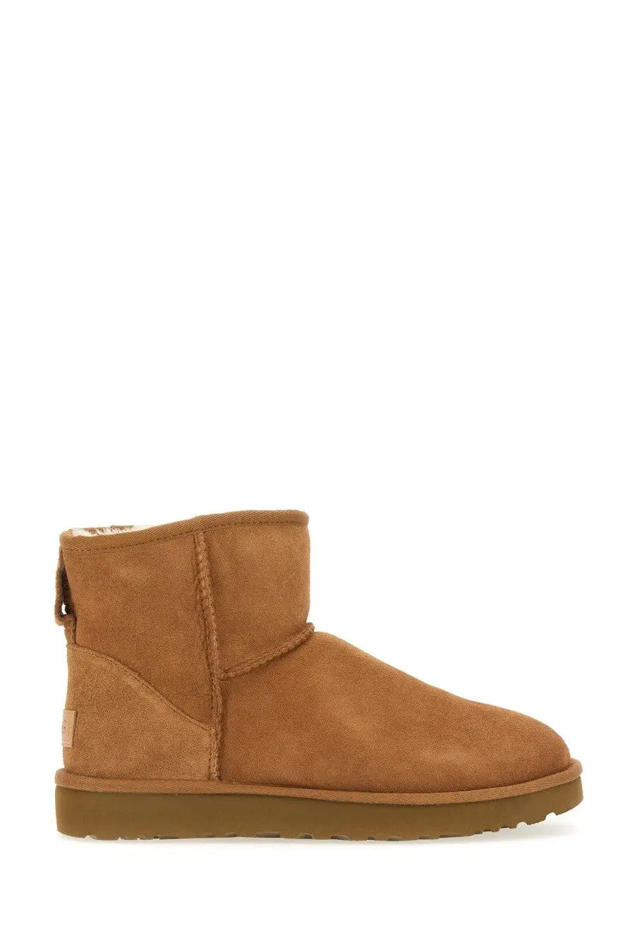 Ugg women’s boot classic mini brown tan suede with plush interior and durable rubber sole for casual wear