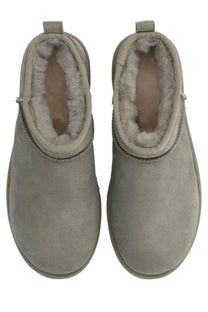 Gray suede ugg women’s boot classic ultra mini with plush white shearling lining