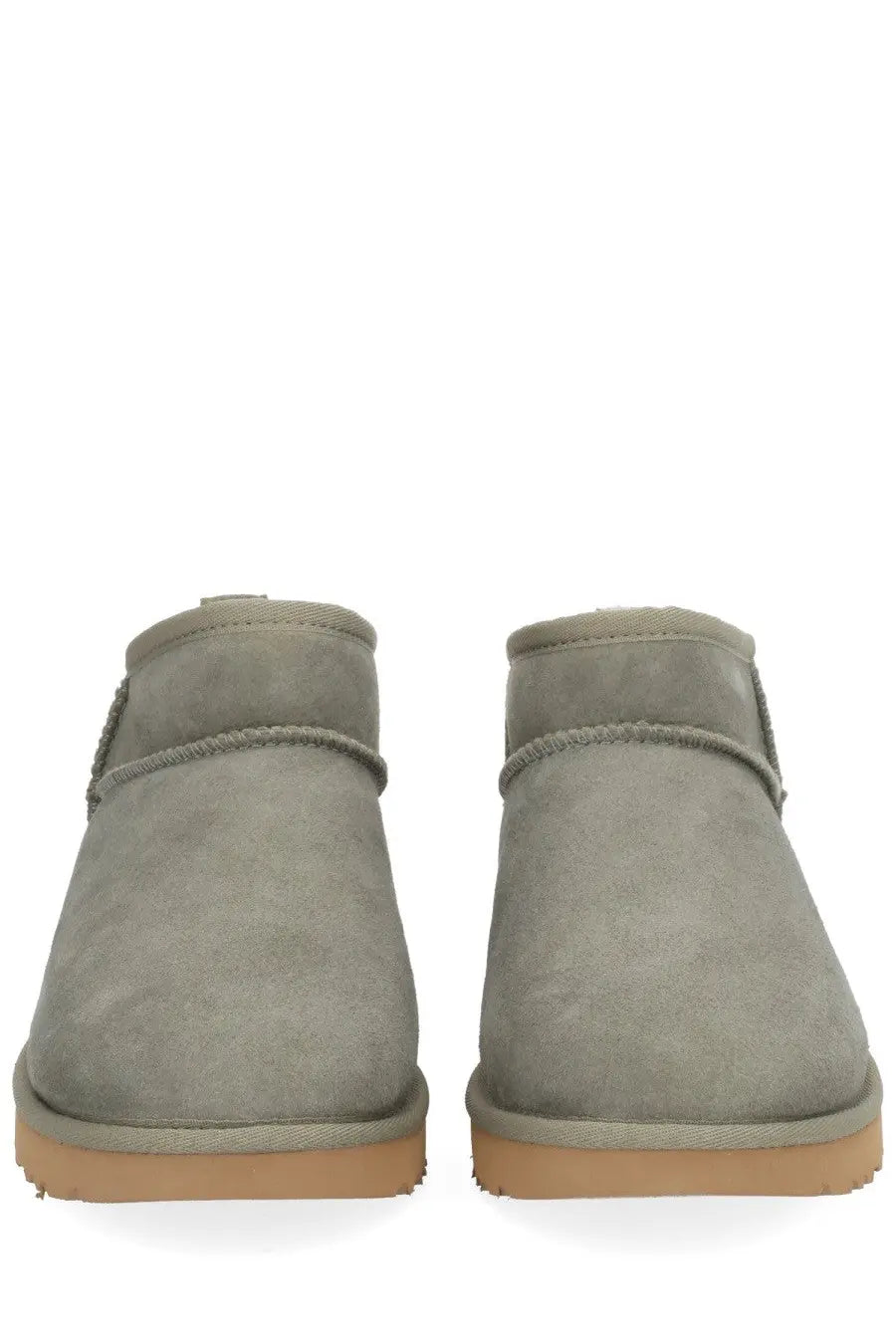 Ugg women’s classic ultra mini green gray suede booties with tan rubber sole and stitched detailing front view