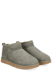 Ugg women’s gray suede ankle boots with plush interior and tan rubber soles classic ultra mini style