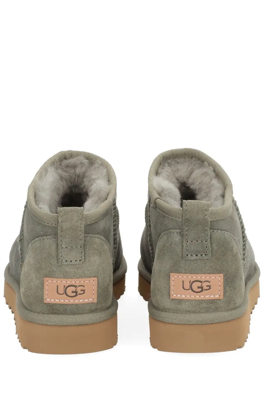 Ugg women’s boot classic ultra mini green olive green suede with tan rubber soles and plush gray lining front view