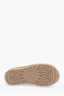 Back side of ugg womens classic mini platform suede ankle boots brown showing beige rubber sole with sunburst tread and ugg logo