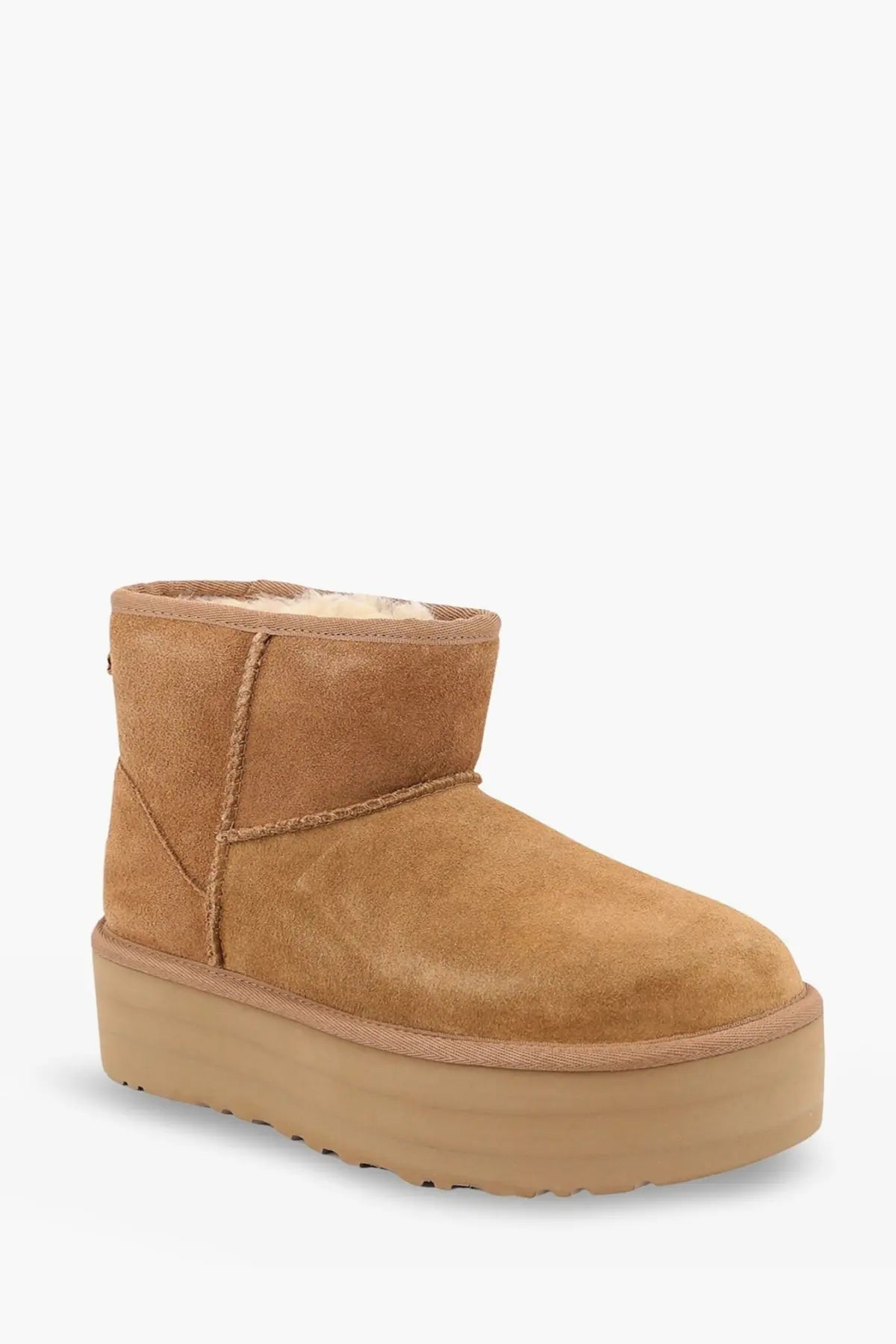 Ugg women’s classic mini platform suede ankle boot in tan with plush shearling lining and brown platform sole