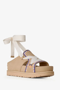 Ugg women’s goldenstar hi artistitch beige suede platform sandal with white ribbon tie and embroidered floral pattern