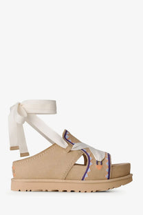 Ugg women’s goldenstar hi artistsitch beige suede platform sandals with white ribbon ankle strap and colorful embroidery