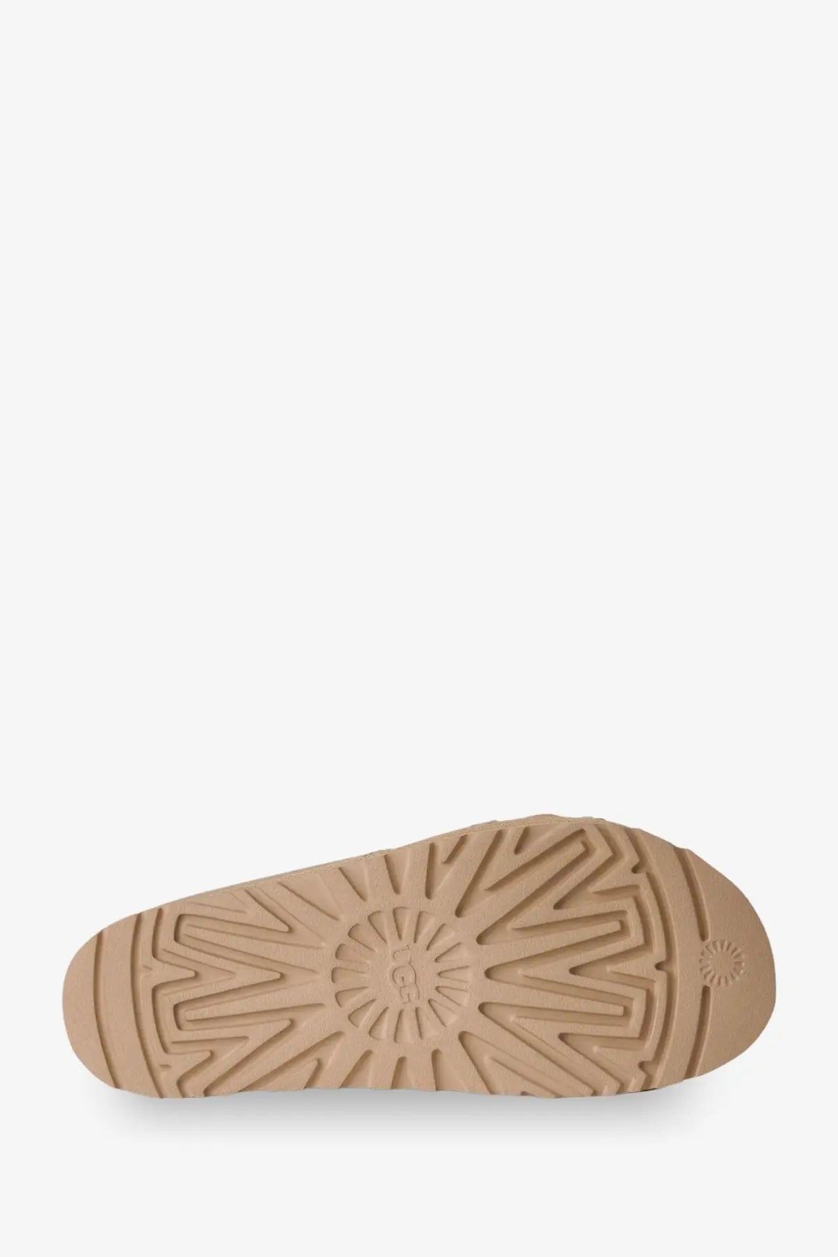Tan rubber sole with sunburst tread and embossed ugg logo on the back of ugg women’s goldenstar hi artistitch beige suede sandals