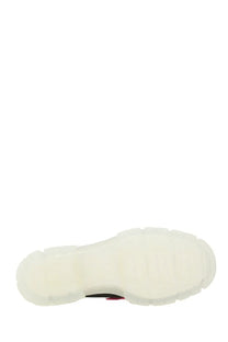 Ugg women’s mary jane areum black showing white rubber sole with chunky textured design