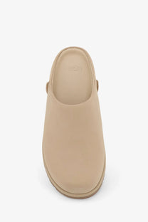 Beige ugg women’s nubuck sandals with a soft suede-like upper and cushioned sole for comfortable wear