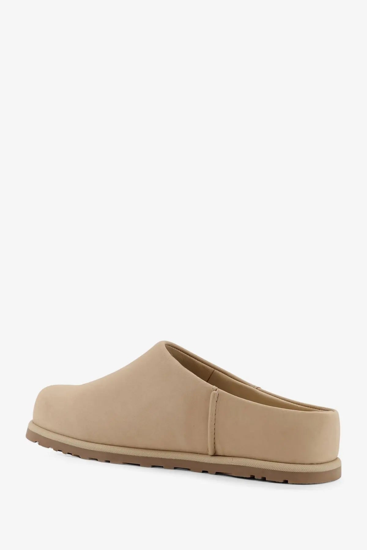 Ugg women’s beige nubuck slip-on clog with smooth minimalist design and slightly textured rubber sole