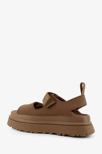 Ugg women’s brown platform sandal with thick rubber sole and adjustable strap for comfortable wear