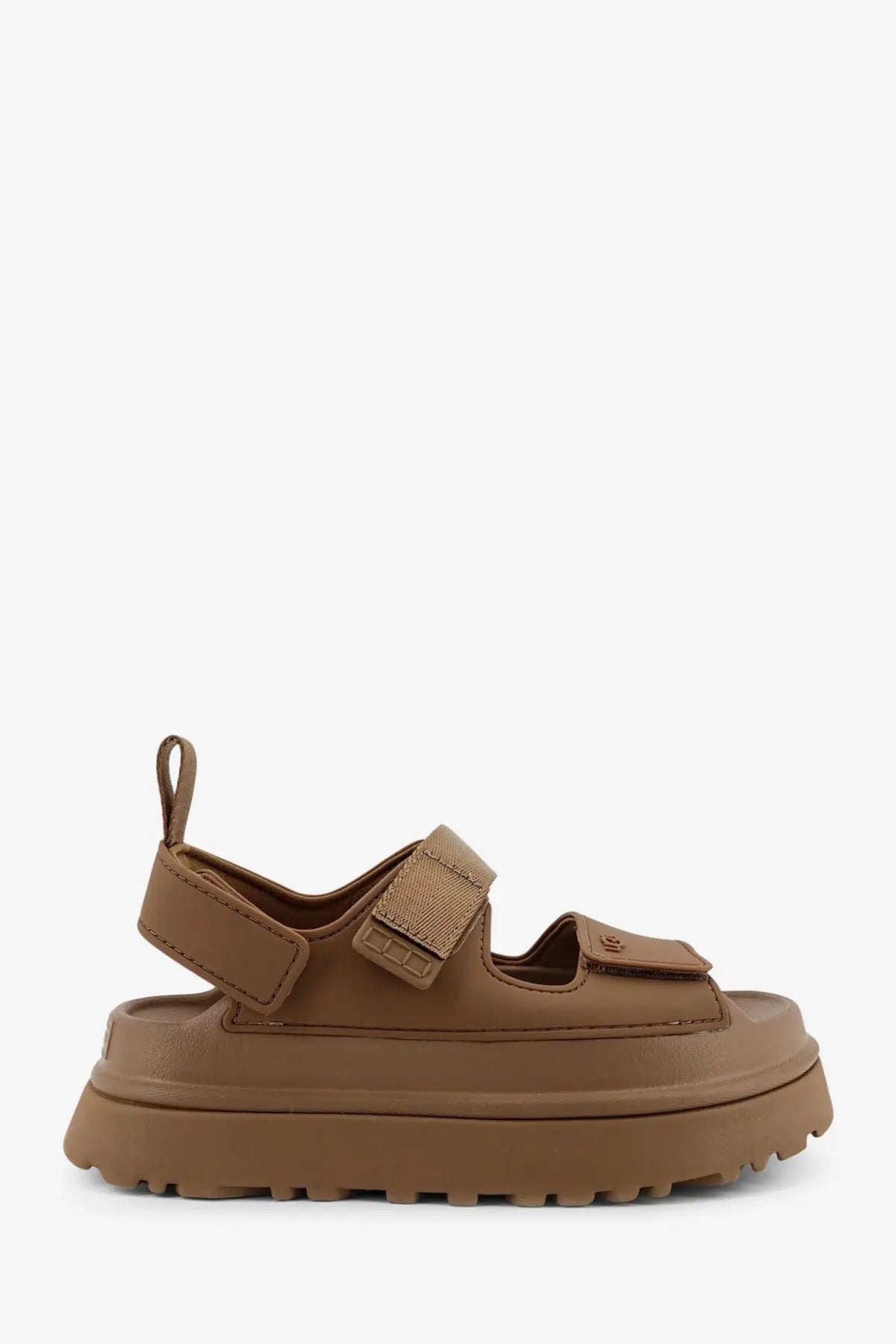 Ugg women’s brown rubber platform sandal with thick sole and adjustable velcro straps shown from the back side
