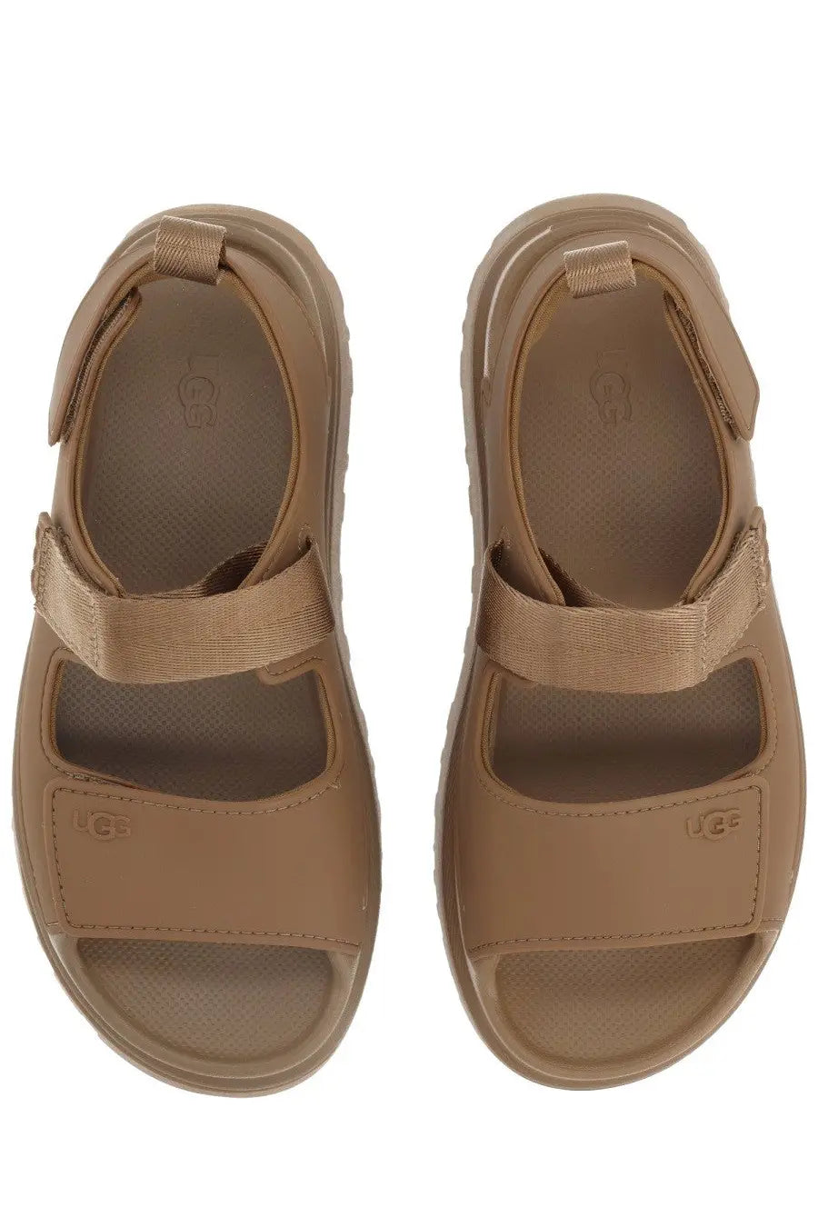 Ugg women’s sandal goldenglow brown with tan cushioned sole and adjustable velcro straps for comfortable wear
