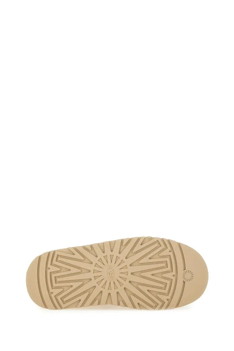 Beige rubber sole of ugg women’s tazz ii plateau sandal with geometric tread pattern and ugg logo near the heel