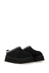Ugg women’s tazz ii platform slip-on mules in black with white zigzag stitching along the collar
