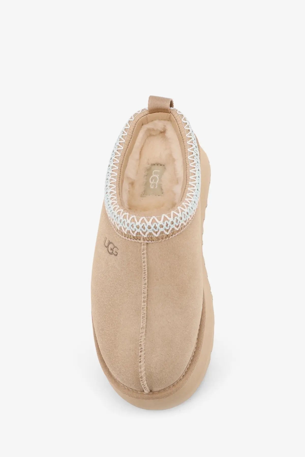 Beige ugg women’s tazz suede slip-on sandals with decorative white zigzag trim and soft suede exterior