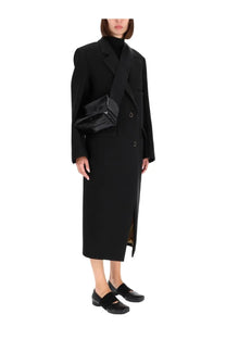 Black glossy patent leather crossbody bag with structured rectangular shape and minimalist silver hardware for uma wang women’s cassandra coat black