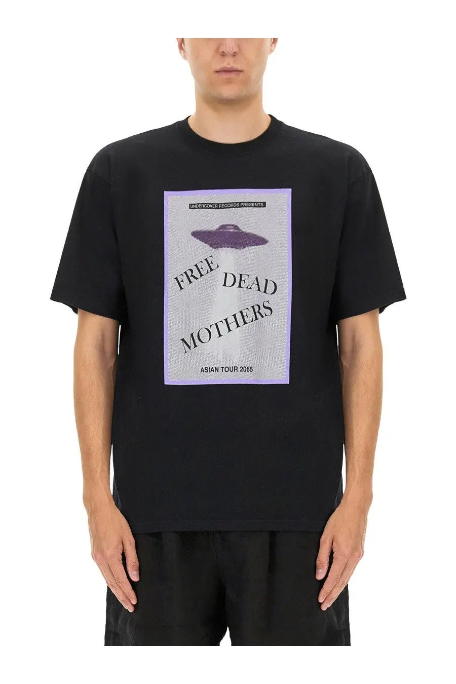 Undercover men’s black short-sleeved t-shirt with purple ufo graphic and lavender bordered gray label on front