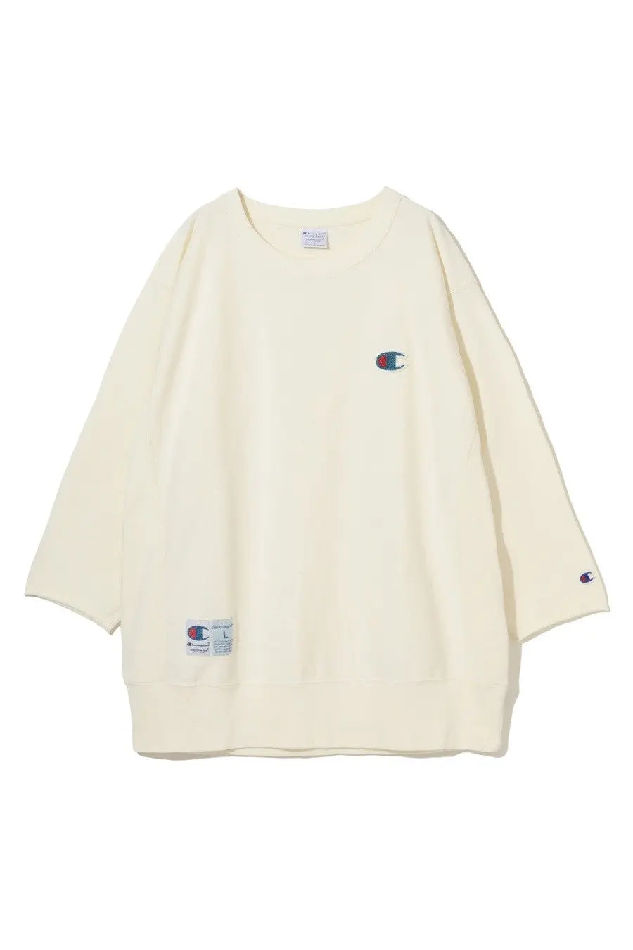 Cream-colored unisex Champion sweatshirt with embroidered logo on chest and sleeve featuring classic crew neck design